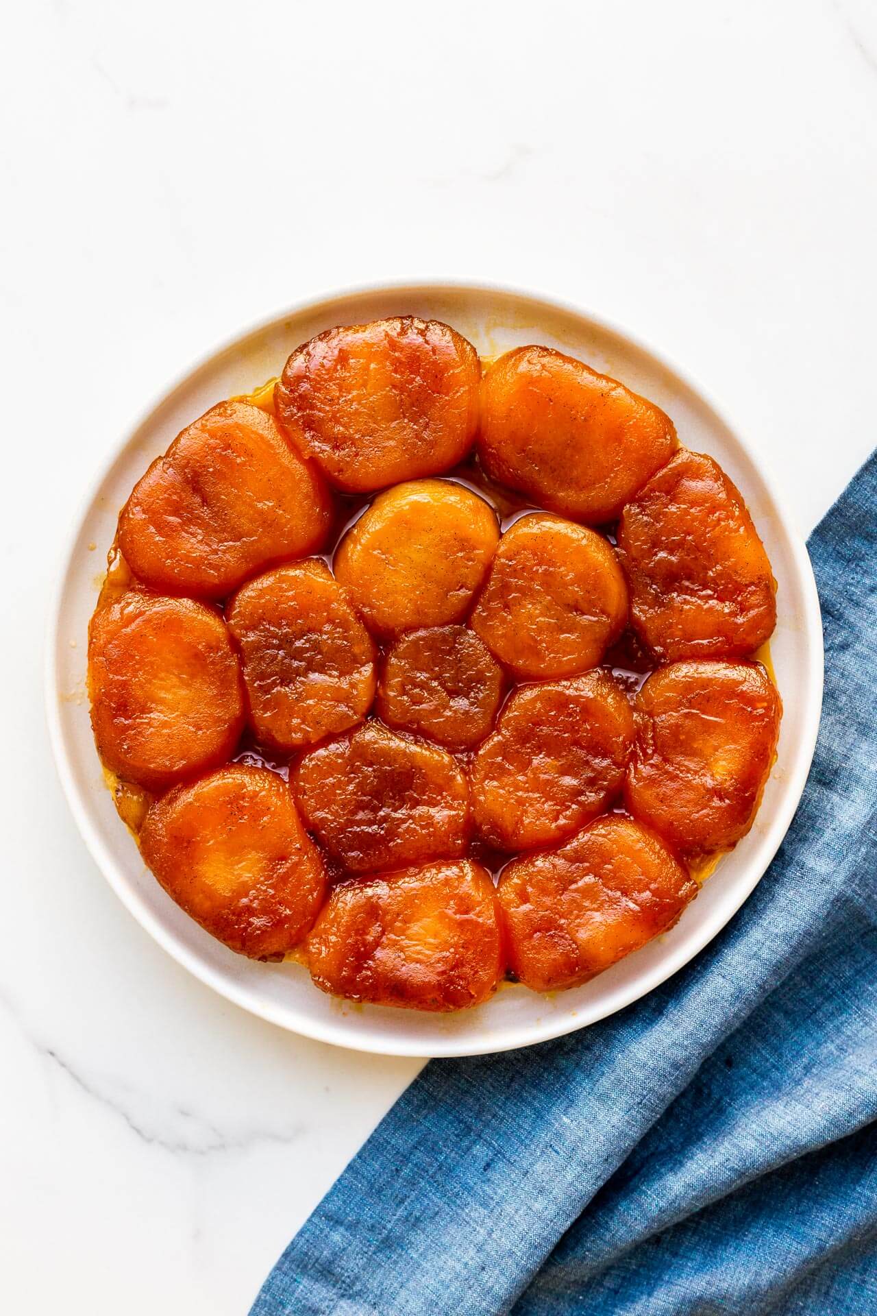 Apple tarte tatin ready to be sliced and served warm.