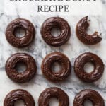 nine double chocolate donuts that are chocolate cake donuts topped with chocolate ganache glaze and chocolate sprinkles