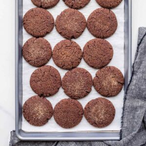 A pan of chocolate spice cookies topped with cinnamon sugar.