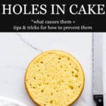 A round vanilla butter cake trimmed with a serrated knife to show the crumb and bubbles and holes in the cke and a red striped kitchen linen towel