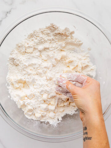 Working butter into flour with fingertips.