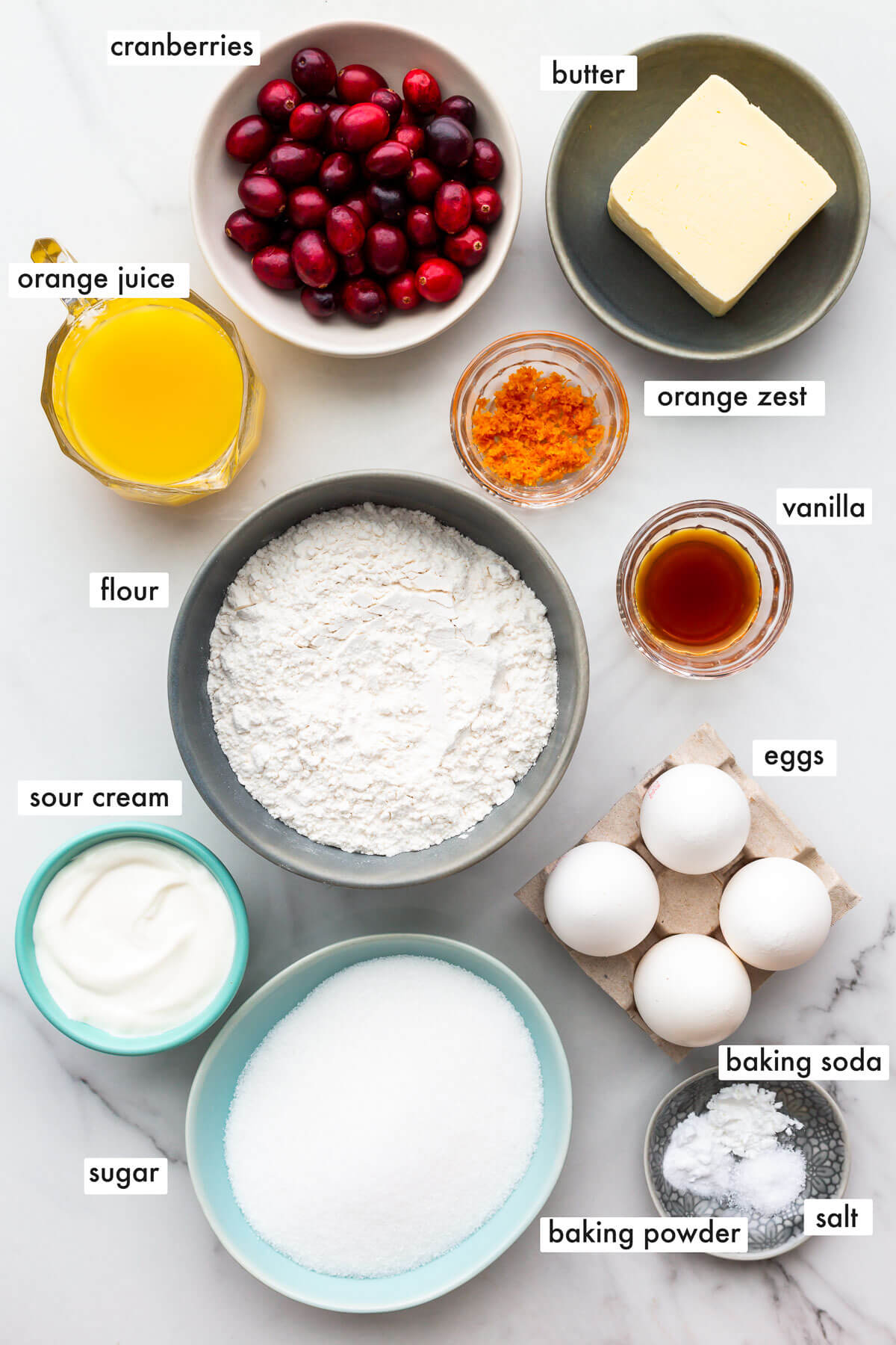 Ingredients to make an orange cranberry bundt cake measured out.