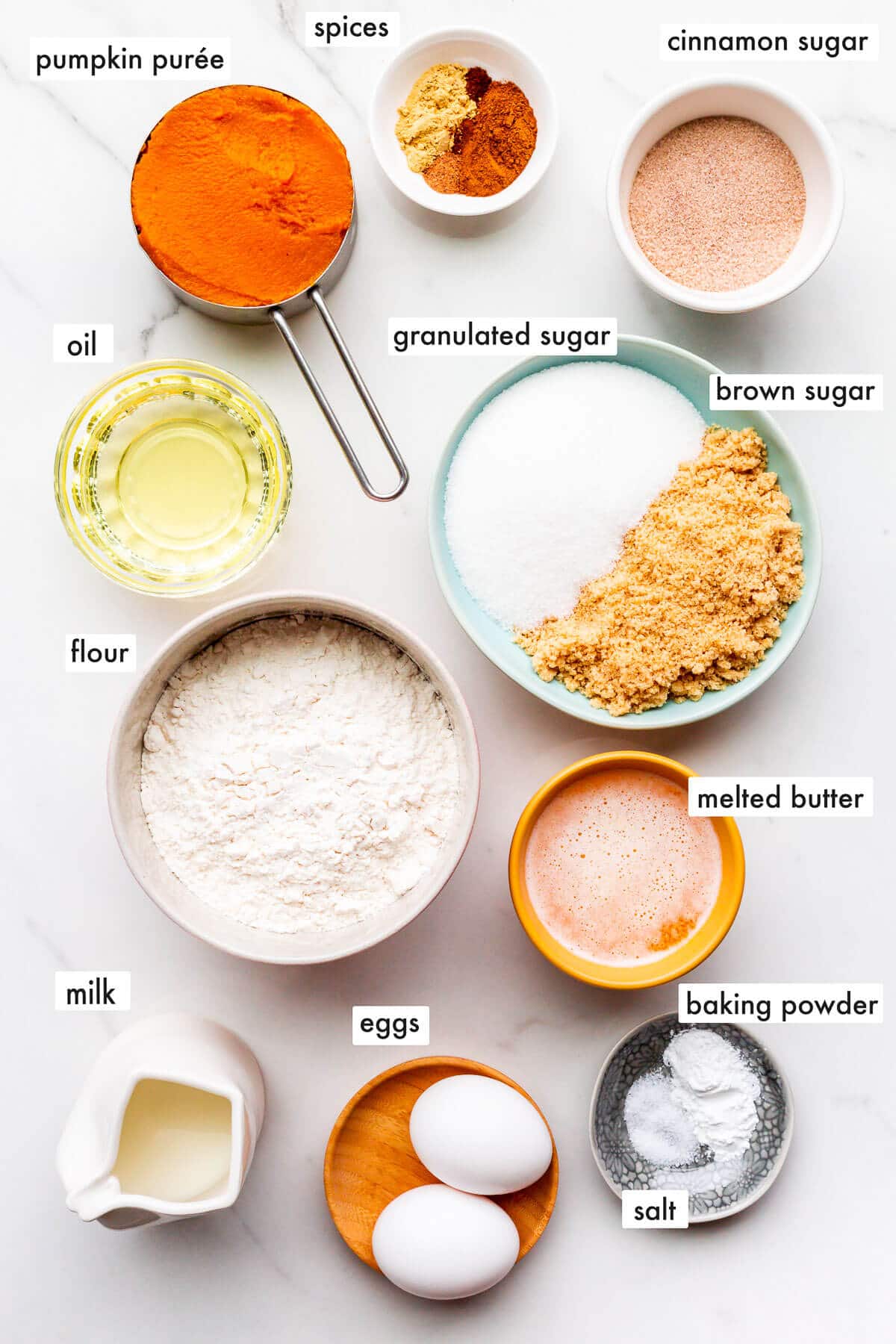 Ingredients to make pumpkin donuts measured out and ready to be mixed.