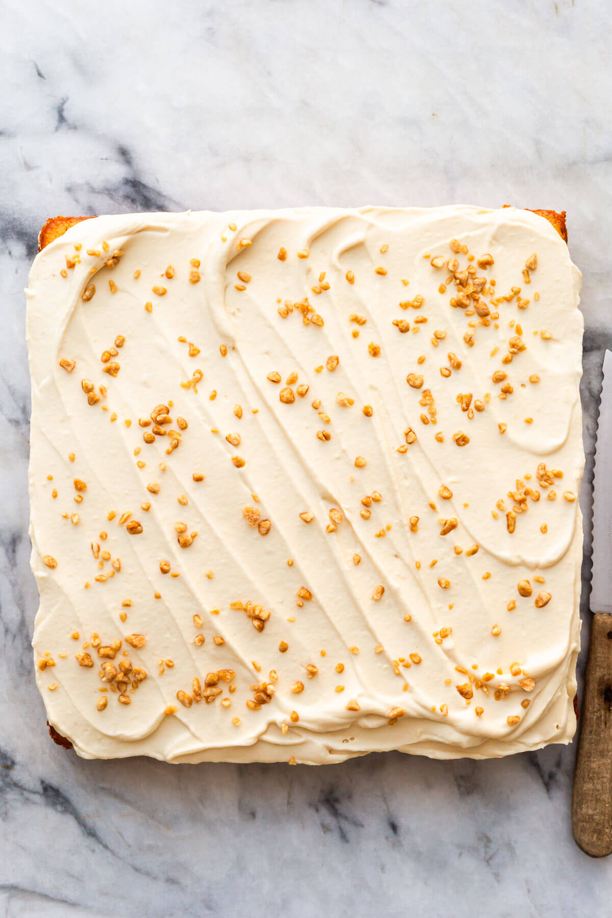 Swirls of maple whipped cream on a cake.