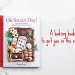 Book cover of Oh Sweet Day! baking book with a gift box filled with a variety of homemade cookies