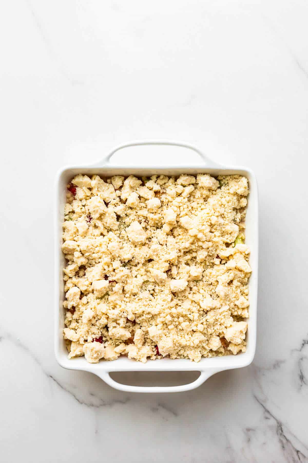 A rhubarb crumble before baking.