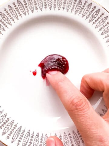 The freezer plate test with a dollop of strawberry jam to show it wrinkles when it sets.